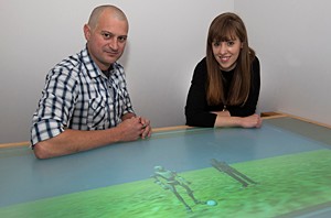 Michael J. Richardson, associate professor of psychology, and psychology doctoral student Auriel Washburn are photographed in UC's Center for Cognition, Action and Perception. 