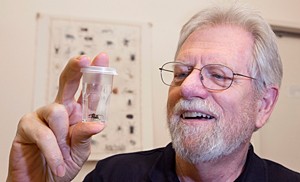 Image of George Uetz and a wolf spider