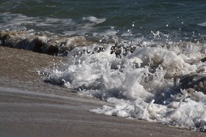 Close-up of an ocean wave with sea foam