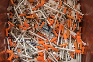 a pile of syringes