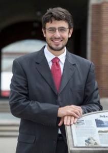 Student Mohamed Elzarka standing in front of UC's McMicken Hall. photo/Andrew Higley