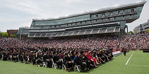 Graduates fill Nippert Stadium at the Spring 2017 Commencement ceremony.