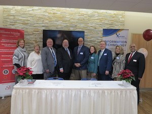 UC and Warren County school leadership pose for a photo