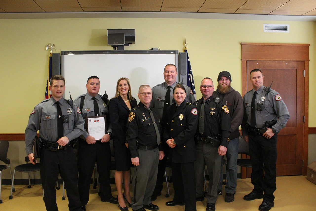 The UCPD Officers and Hamilton County Sheriff's Deputy who saved the life of a construction worker pose after receiving a Life-Saving Award.