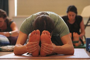 Students stretching in a yoga class