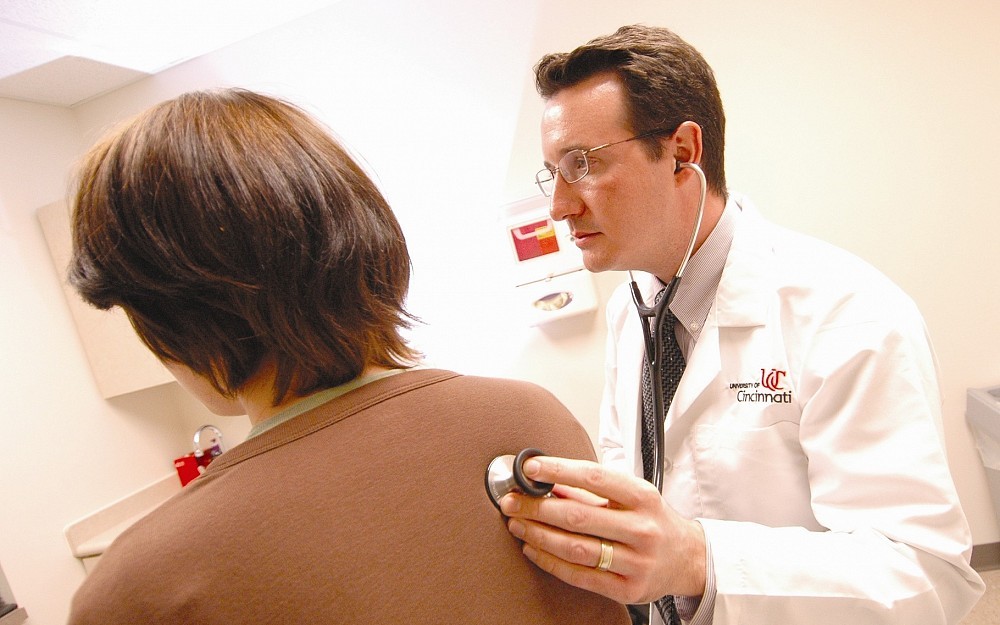 Matthew Hardin, MD, with a patient