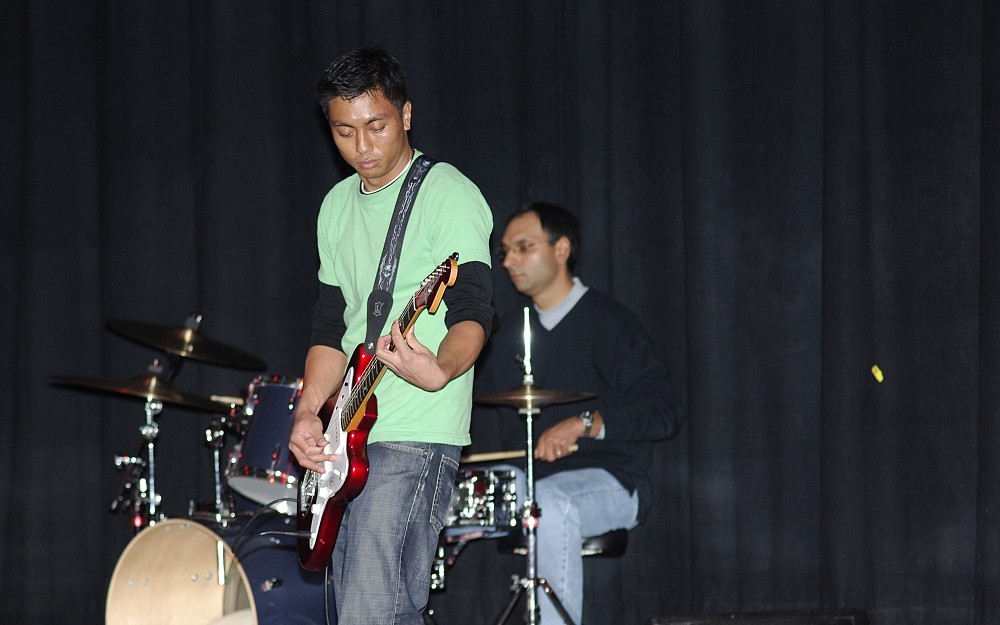 
Medical Student Arvin Ejaz plays the guitar as part of the band Kocher Maneuver, a highlight of a previous IvaDean Scholarship Benefit Concert. 