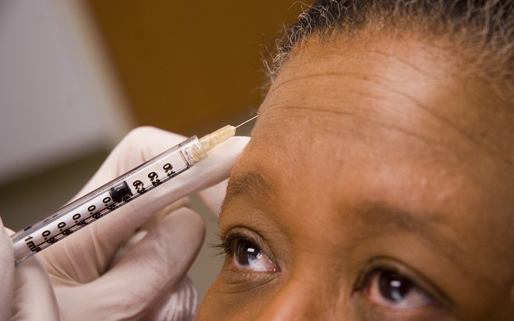 A patient receives a botox injection to help reduce forehead wrinkles. 