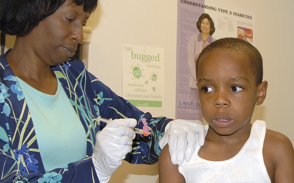 Elijah Williams, 6, receives his hepatitis A and Chicken Pox vaccinations.