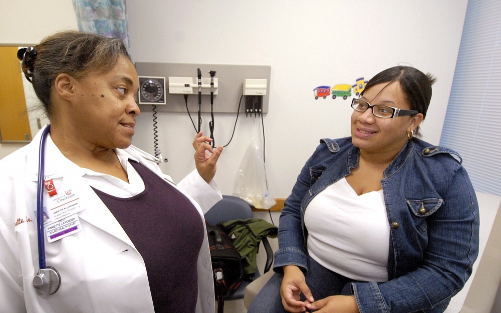 Nurse practitioner Annette Lavender offers advice to Monica Williams, 25, a sickle cell patient, during one of her routine visits.