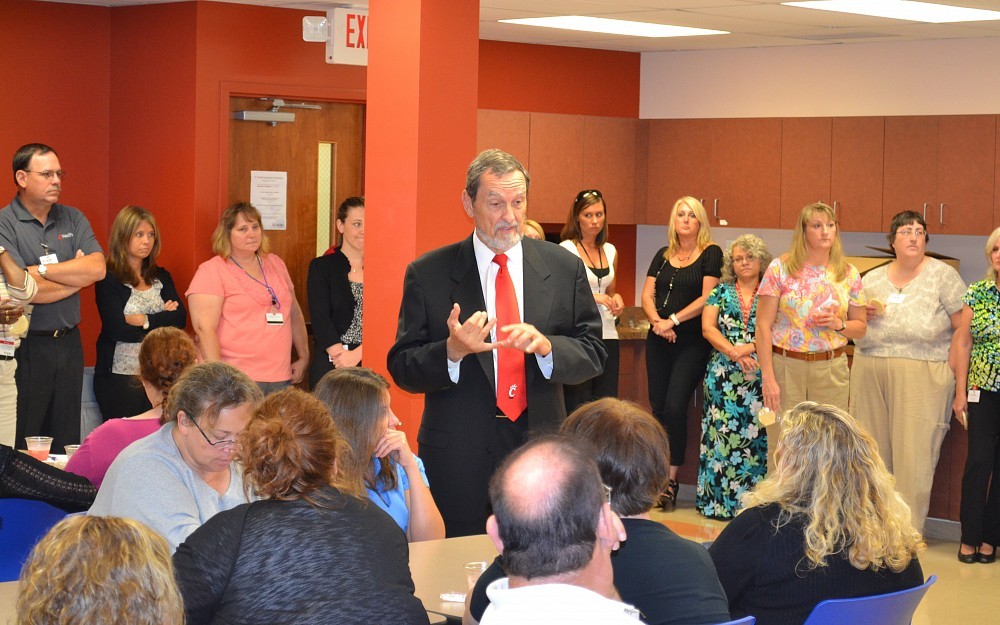 Thomas Boat, MD, speaks to UC Physicians employees at the Victory Parkway business office.