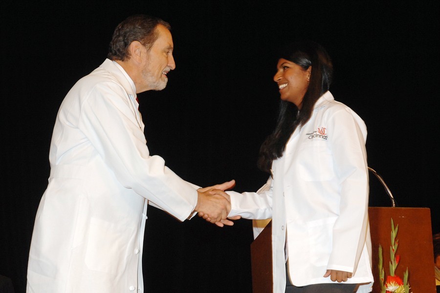 Thomas Boat, MD, dean of the College of Medicine, welcomes medical student Noopur Jain to the class of 2015