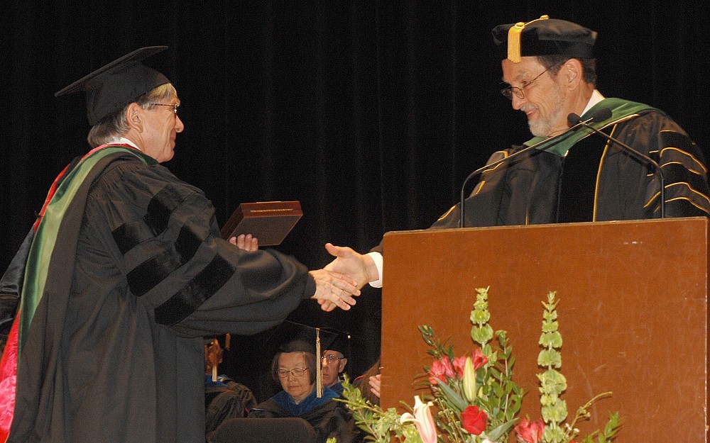 Robin Cotton, MD, (left) accepts his Daniel Drake Medal from College of Medicine Dean Thomas Boat, MD.