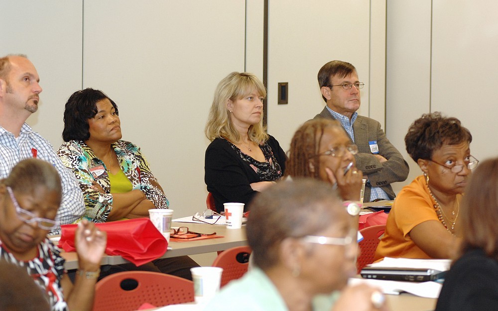 Magdalena Szaflarski, MD, (back row, center) is leading an academic-community partnership to address HIV/AIDS among African-Americans by educating clergy about prevention and treatment. A mobilization meeting was held May 4 at the American Red Cross building in Cincinnati.