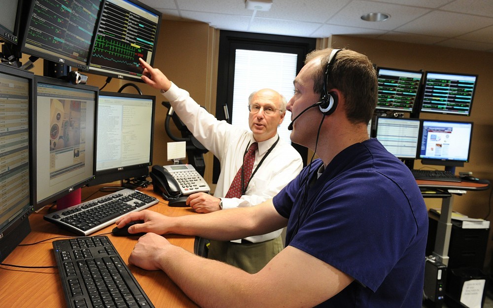 Ralph Panos, MD, in the TeleICU with Assistant Nurse Manager Chad Daniels