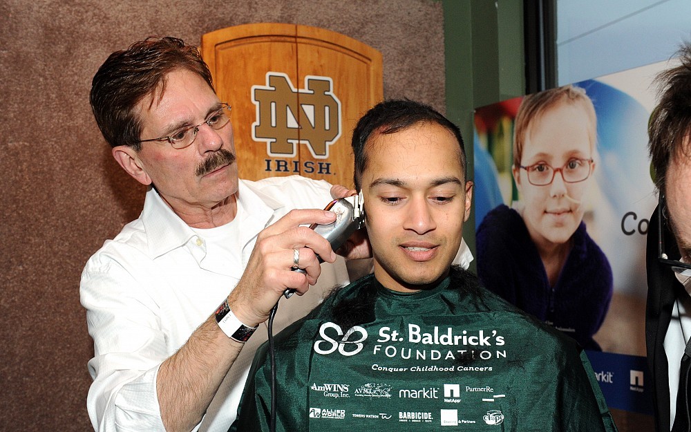 Bruce Giffin mans the clippers during St. Baldrick's Day. 