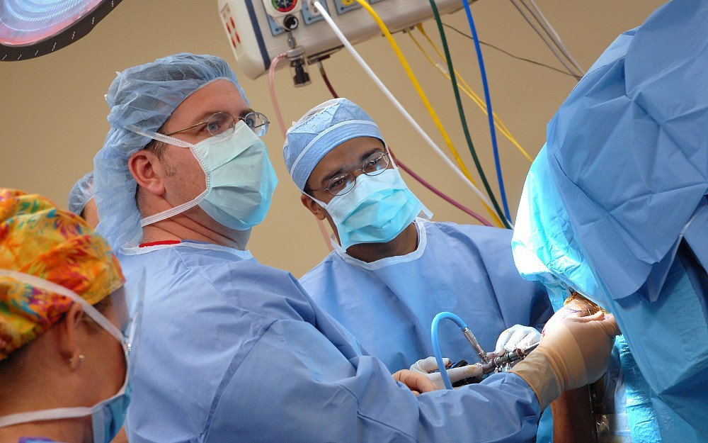 Orthopedic surgeon Keith Kenter, MD, seen here using a scope to examine a patient's joint. 