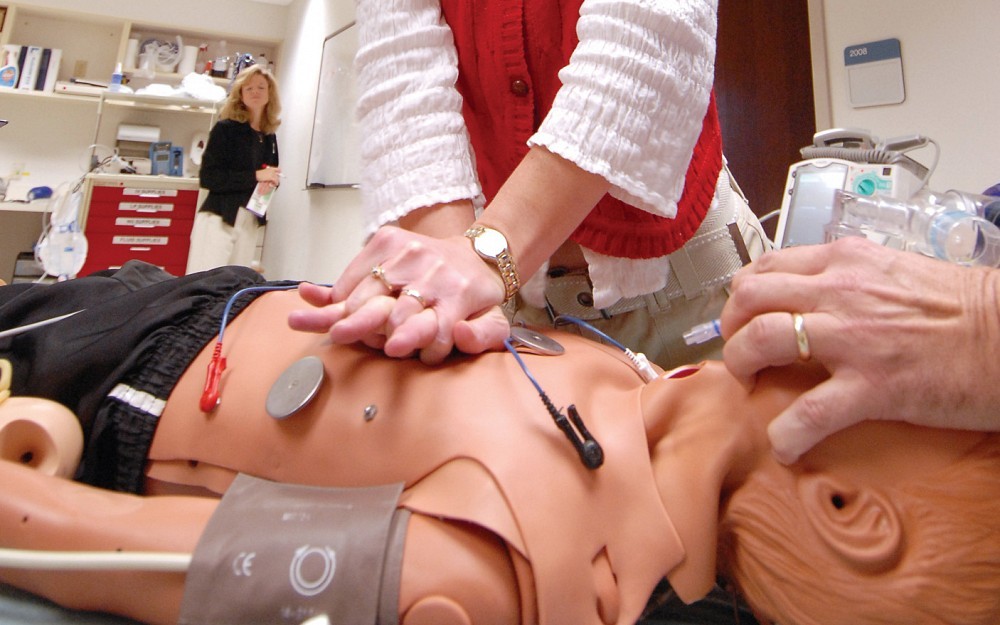 Shelley Post performs CPR on a human patient simulator during a pediatric advanced life support course at Cincinnati ChildrenÂ s Center for Simulation and Research.