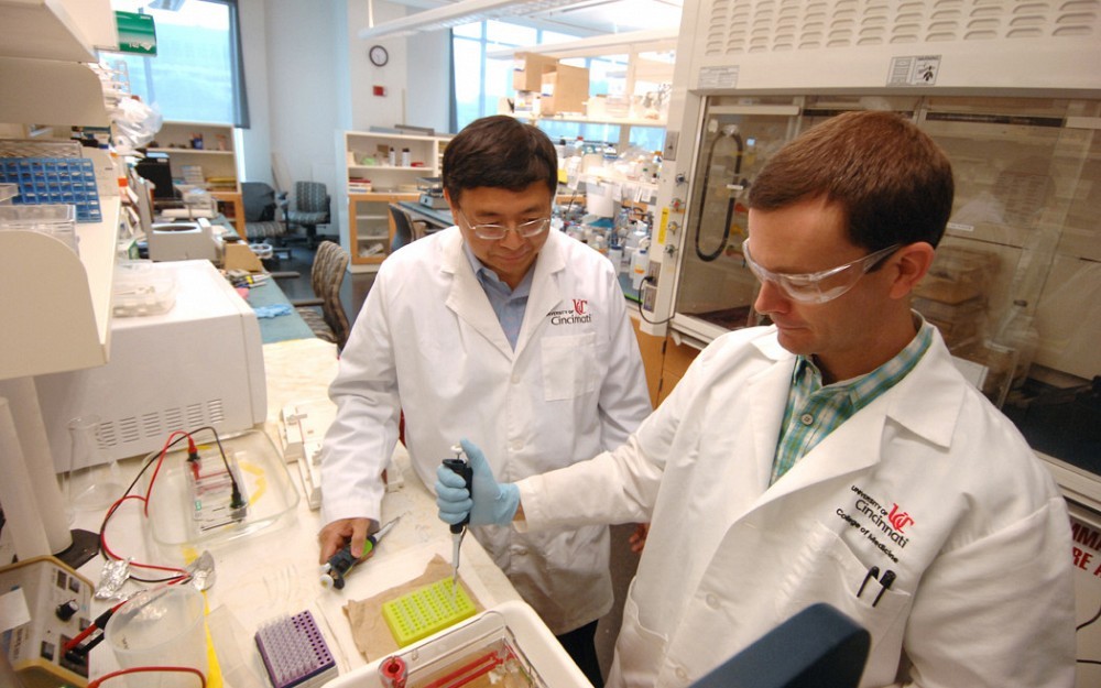 Jun-Lin Guan, PhD, with a member of his lab