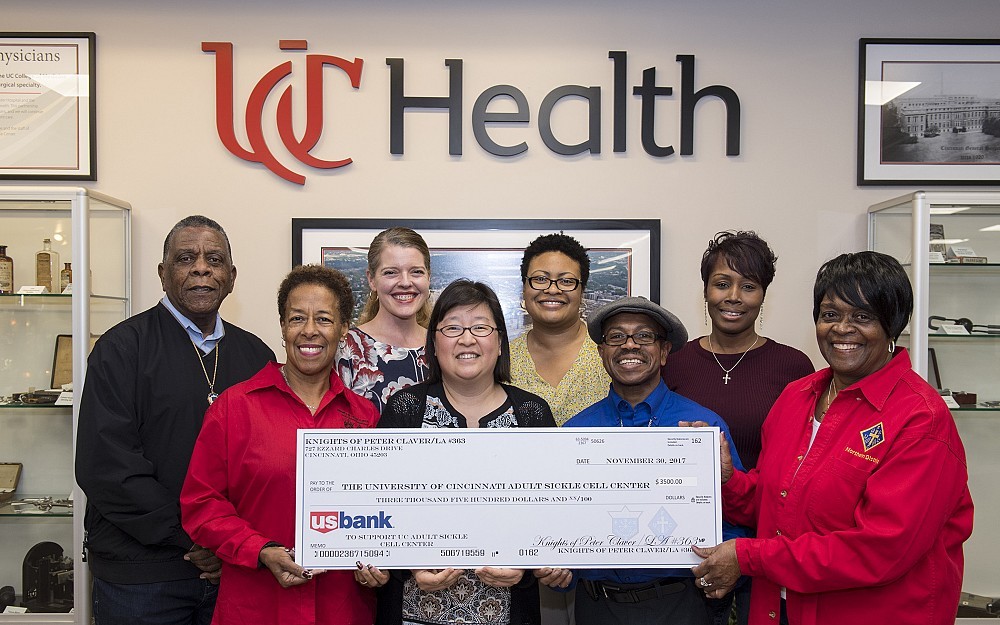 The Knights of Peter Claver present a check to UC Medical Center. Front left to right: Denise Stockstill, Hyon Kim, MD, Reginald Lee and Tommie Prichett. Rear left to right are: Ronald Garvin, Tiffany Diers, MD, Connette Birl, RN, and Erica Sanderson.