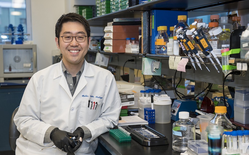 Andrew Kim, a fourth-year graduate student in the Medical Scientist Training Program, is shown in a laboratory at Cincinnati Children's.