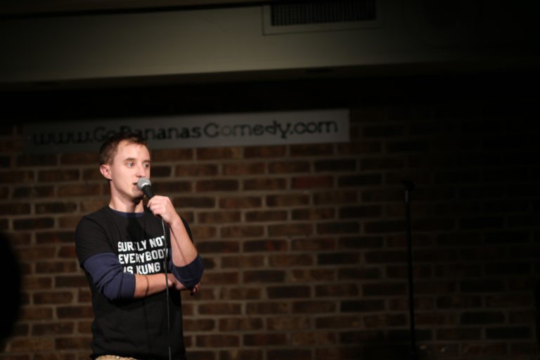 Tanner Hinds performs onstage at Go Bananas, a local comedy club. Hinds says after TMS therapy for his treatment-resistant depression, he was able to return to his interests like performing stand-up.