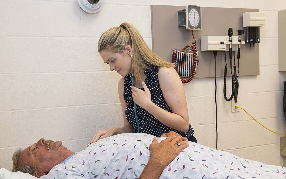Kari Gorder, MD, is shown with a standardized patient during a BRACK session in the College of Medicine.