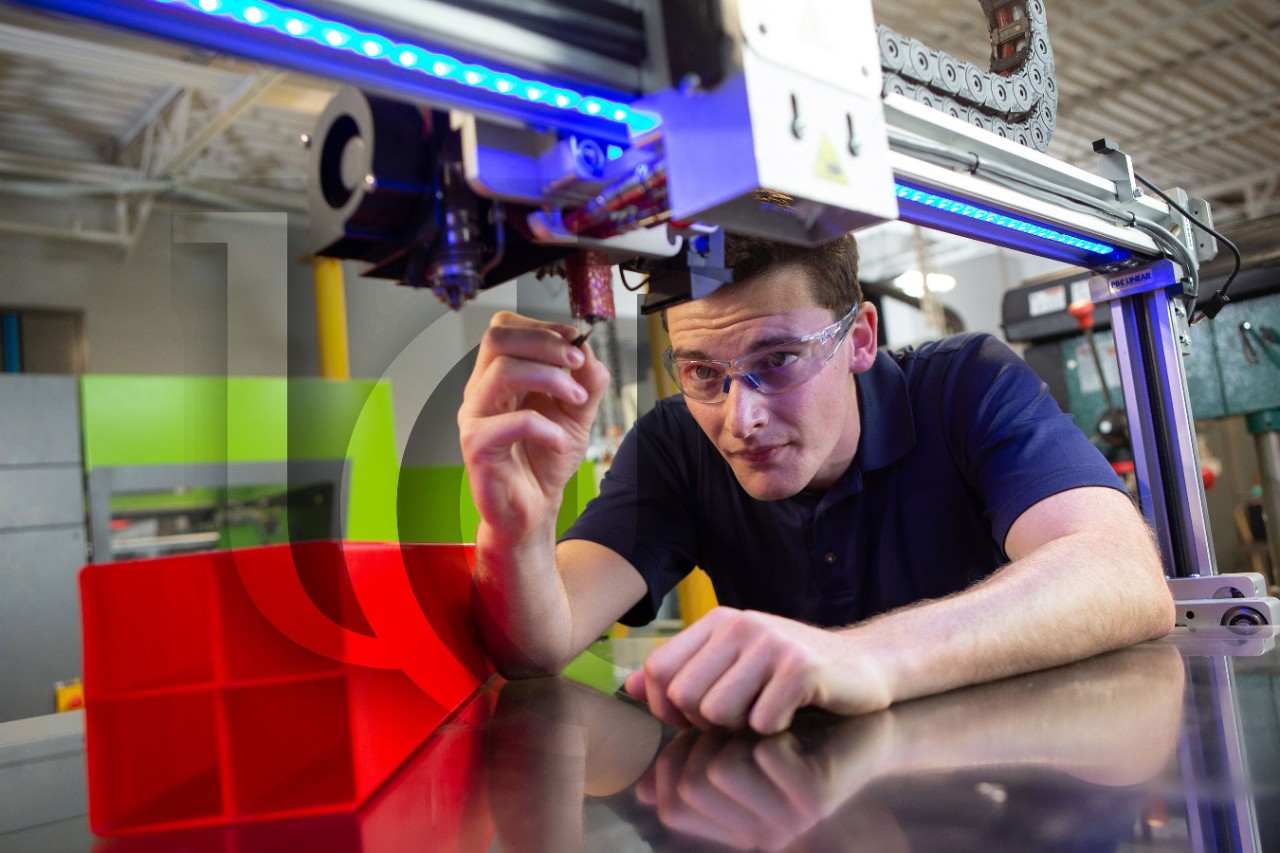 A UC student works in an engineering lab